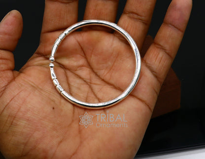 Sterling silver handmade bangle bracelet with a shiny plain design, adjustable unisex kada by TRIBAL ORNAMENTS.