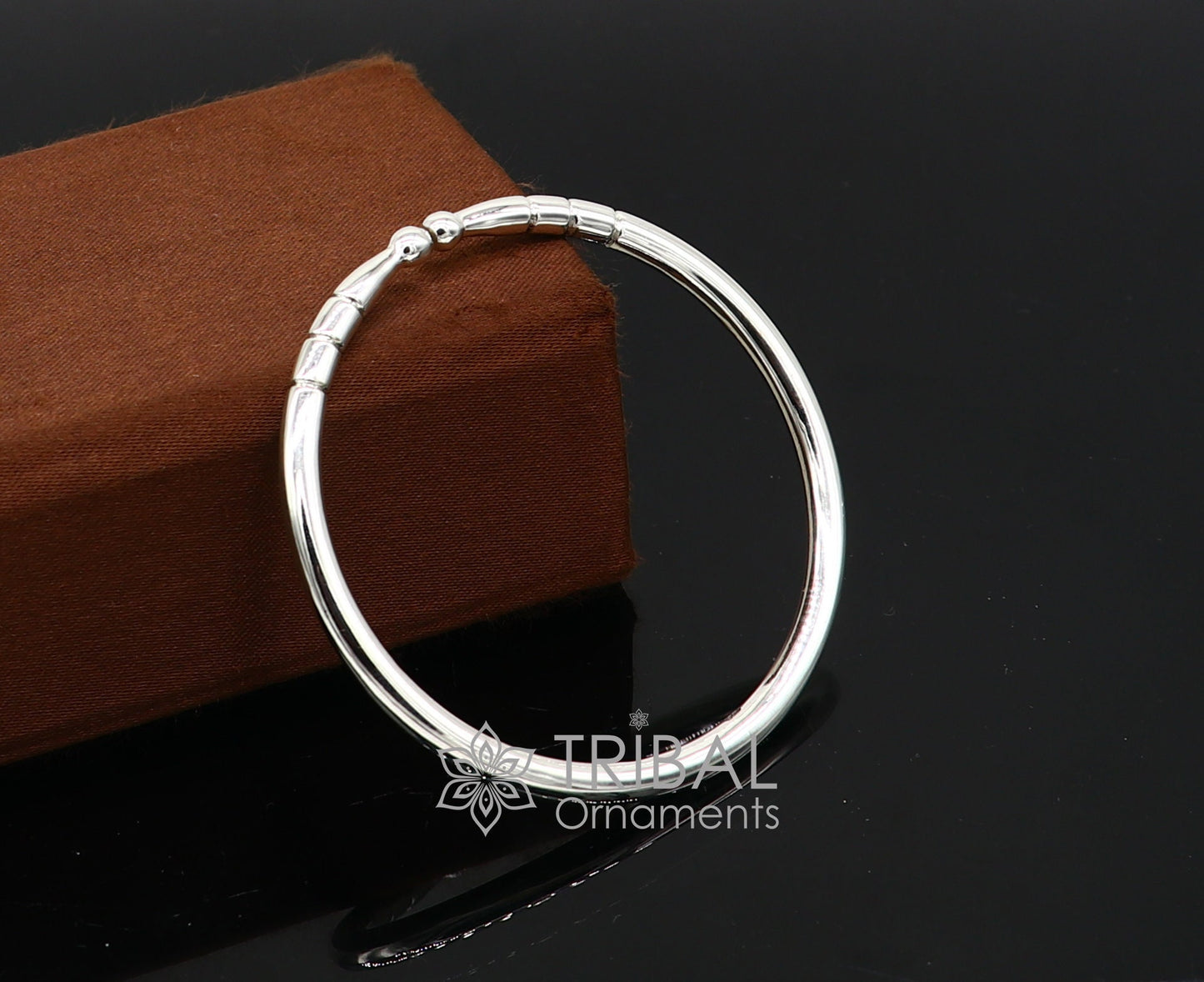 Sterling silver handmade bangle bracelet with a shiny, plain design, adjustable unisex kada by TRIBAL ORNAMENTS.