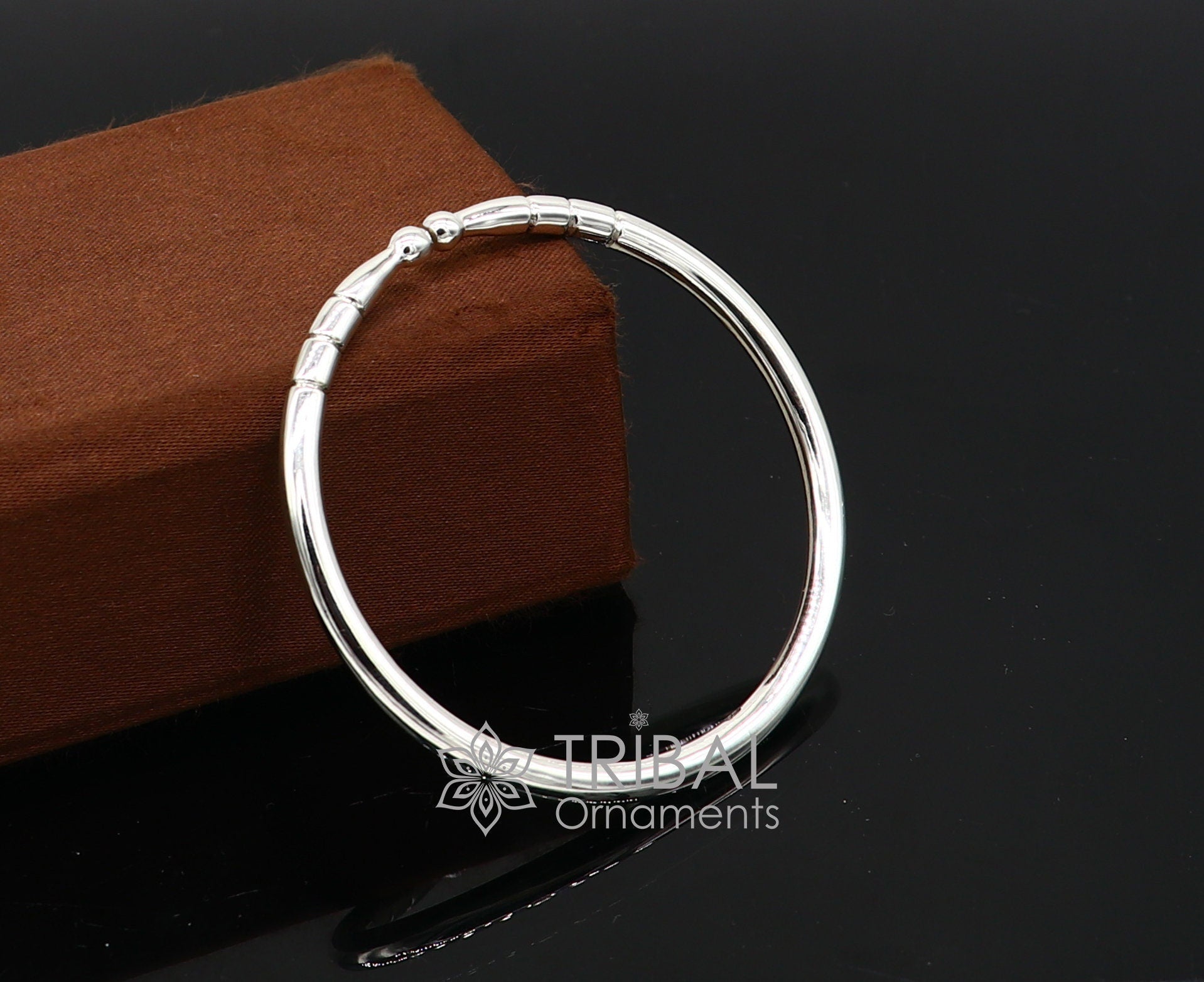 Sterling silver handmade bangle bracelet with a shiny, plain design, adjustable unisex kada by TRIBAL ORNAMENTS.