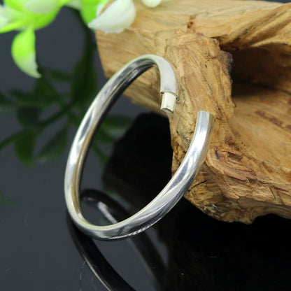 Sterling silver baby bracelet bangle with traditional Punjabi Kada design, handmade by Tribal Ornaments for newborns.