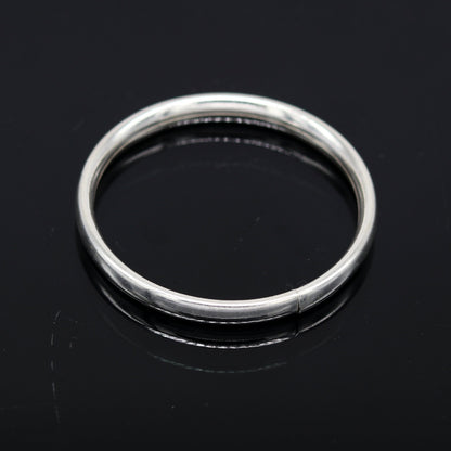 Sterling silver 4mm baby bracelet bangle with traditional Punjabi kada design, handmade tribal ornaments for newborns.