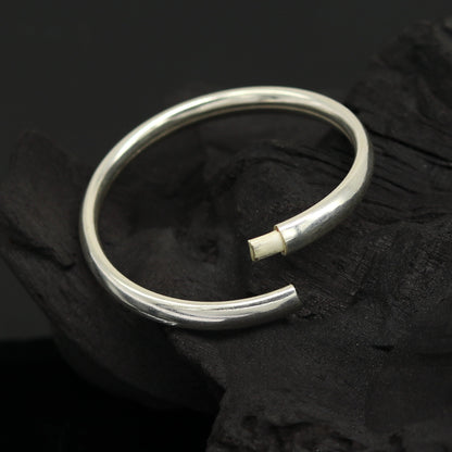 Sterling silver baby bracelet bangle with traditional Punjabi kada design, handmade for newborns by TRIBAL ORNAMENTS.