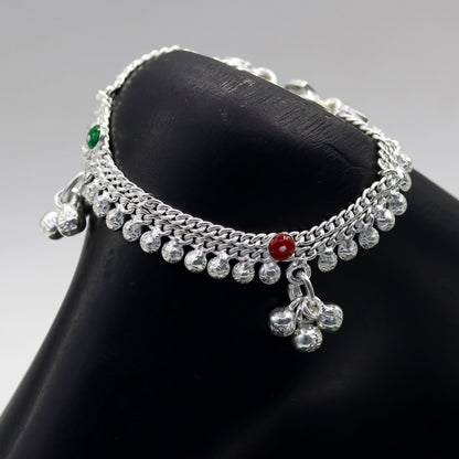 Handmade sterling silver vintage-style baby ankle bracelet with noisy bells and charm, featuring delicate craftsmanship and intricate details.