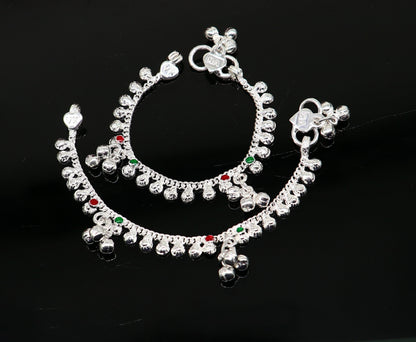 Handmade sterling silver vintage-style baby anklet with noisy bells and charm, featuring a 5-inch length and intricate tribal design.