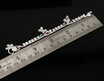 Sterling silver vintage-style baby ankle bracelet with noisy bells and charms, handmade by Tribal Ornaments, 5 inches long.