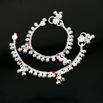 Sterling silver vintage-style baby ankle bracelet with tiny bells and charm, handcrafted by Tribal Ornaments for newborns.