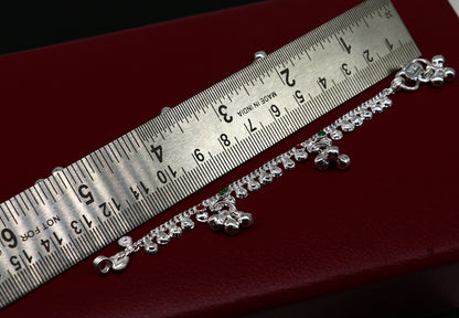 Handmade sterling silver vintage-style baby ankle bracelet with noisy bell charms, featuring a 5-inch length and intricate tribal design.