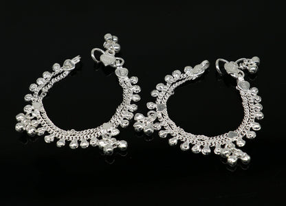 Handmade sterling silver vintage-style baby ankle bracelet with noisy sound bells and charm, designed for newborns.