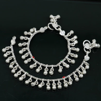 Handmade 5.5-inch sterling silver baby anklet with waved design and jingling bells, featuring tribal ornament style for kids.
