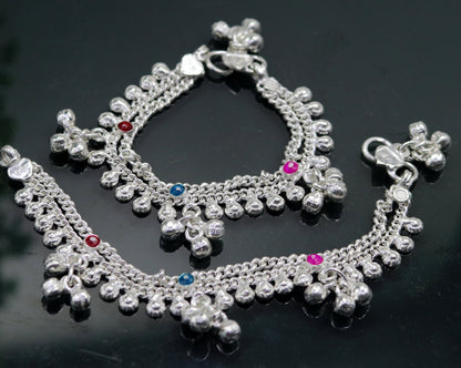 Handmade 5.5-inch sterling silver baby ankle bracelet with charms, crafted by TRIBAL ORNAMENTS, suitable for kids' foot jewelry.