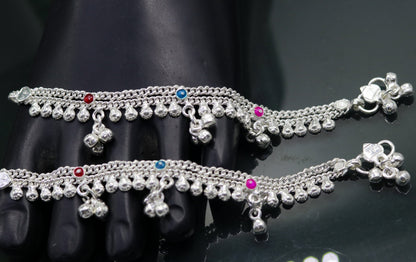 Handmade 5.5-inch sterling silver baby ankle bracelet with charms, crafted by TRIBAL ORNAMENTS for kids' jewelry and foot adornment.
