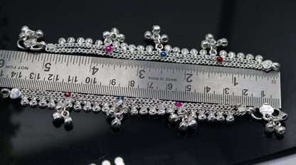 Handmade 5.5-inch sterling silver baby ankle bracelet with charms, crafted by TRIBAL ORNAMENTS, suitable for kids' foot jewelry.