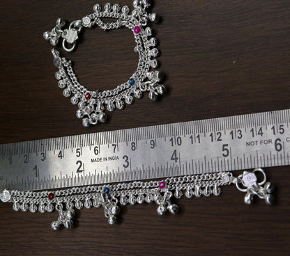 Handmade 5.5-inch sterling silver baby ankle bracelet by TRIBAL ORNAMENTS with charms, perfect for kids' foot jewelry.