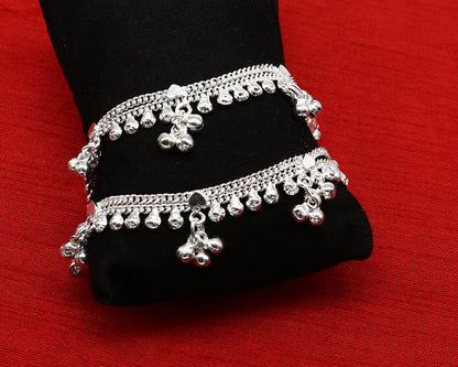 Handmade 5.5-inch sterling silver baby anklet with unisex design and customizable charm, featuring tribal ornament style.