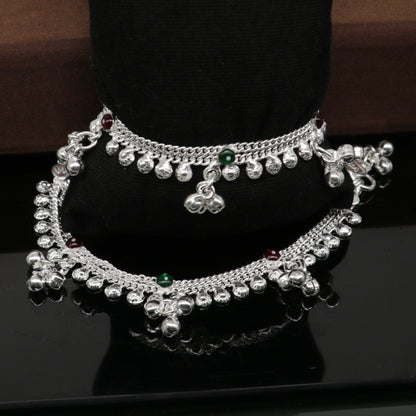 Sterling silver 5.5-inch baby anklet with handmade bells and charm, featuring traditional Indian tribal jewelry style.