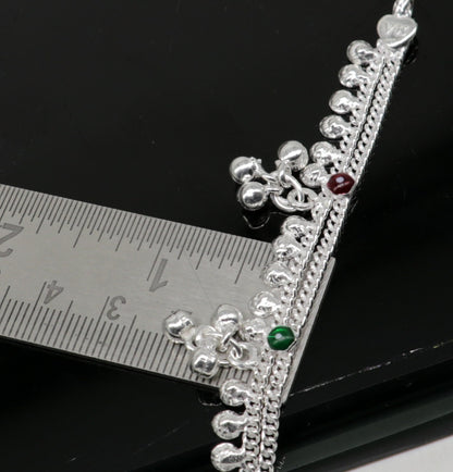 Sterling silver 5.5-inch baby anklet with handmade bells and charms, featuring tribal design and traditional Indian jewelry style.