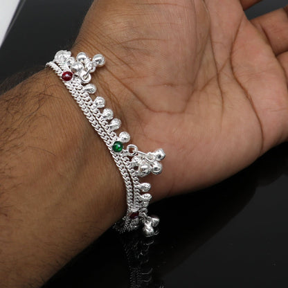 Handmade 5.5-inch sterling silver baby ankle bracelet with a customized charm, unisex design, and foot jewelry style.