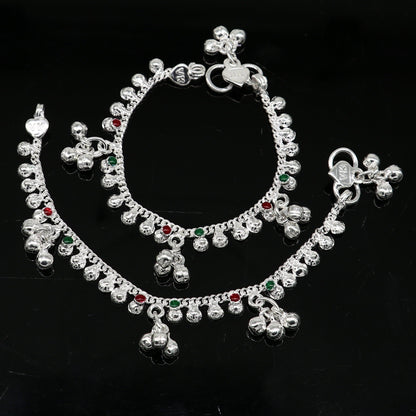 Handmade 5.5-inch sterling silver baby ankle bracelet with delicate charms, unisex elegant jewelry by TRIBAL ORNAMENTS.