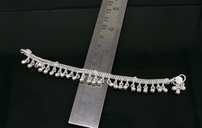 Sterling silver handmade ankle bracelet with bells and charm, 5.5 inches, featuring a delicate chain and foot jewelry design.