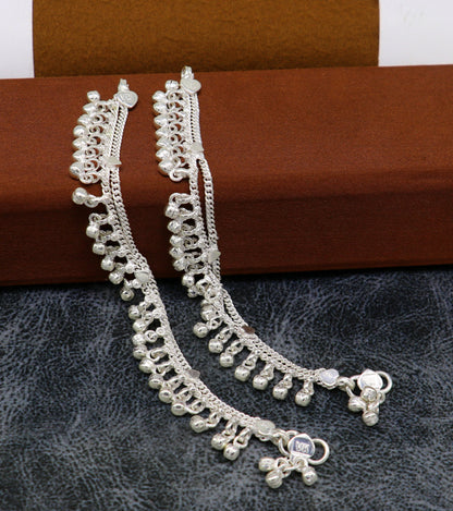 Sterling silver 5.5-inch handmade ankle bracelet with bells, charms, and chain design, suitable for baby or foot jewelry.