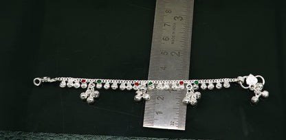 Sterling silver vintage-style baby ankle bracelet with noisy bells and charm, handmade by Tribal Ornaments, 5.5 inches long.
