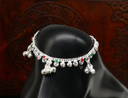 Sterling silver vintage-style baby ankle bracelet with noisy bell charms, handmade jewelry designed for newborns.