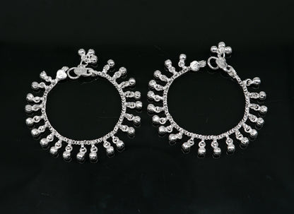 Sterling silver vintage-style baby anklet with 5.5-inch wavy hanging bells, handmade tribal design, perfect as an ankle or charm bracelet.