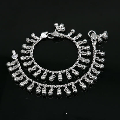 Sterling silver vintage baby anklet with 5.5-inch waved hanging bells, handmade tribal design, perfect as an ankle or charm bracelet.