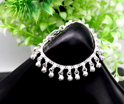 Vintage sterling silver baby anklet with 5.5-inch waved hanging bells, handmade tribal design, perfect for ankle or charm bracelet.
