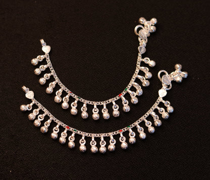 Sterling silver handmade ankle bracelet with charms, tribal jewelry from Rajasthan India, featuring a noisy sound charm for babies.