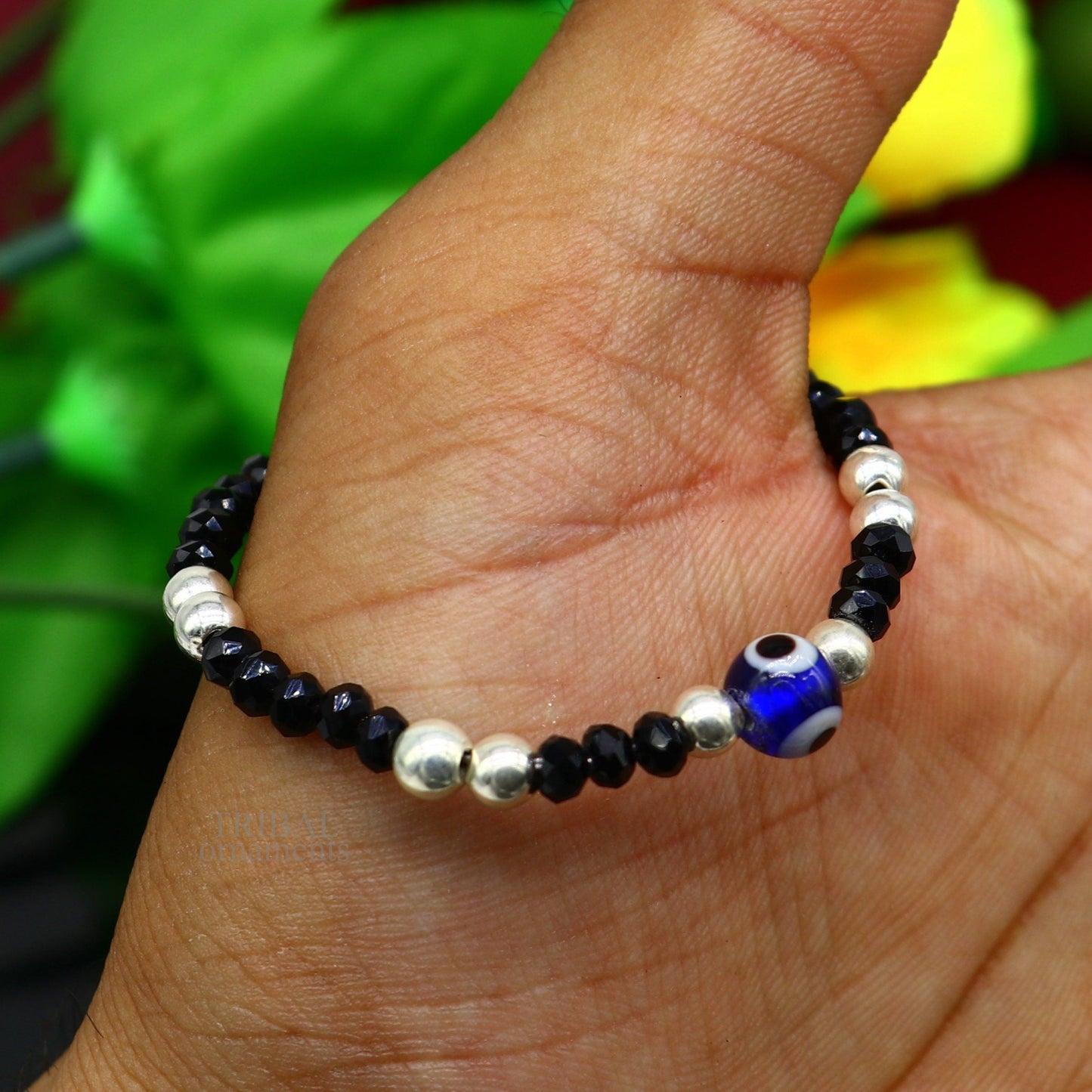Sterling silver handmade beaded evil eye bracelet by TRIBAL ORNAMENTS, stylish unisex kids jewelry with colorful beads.