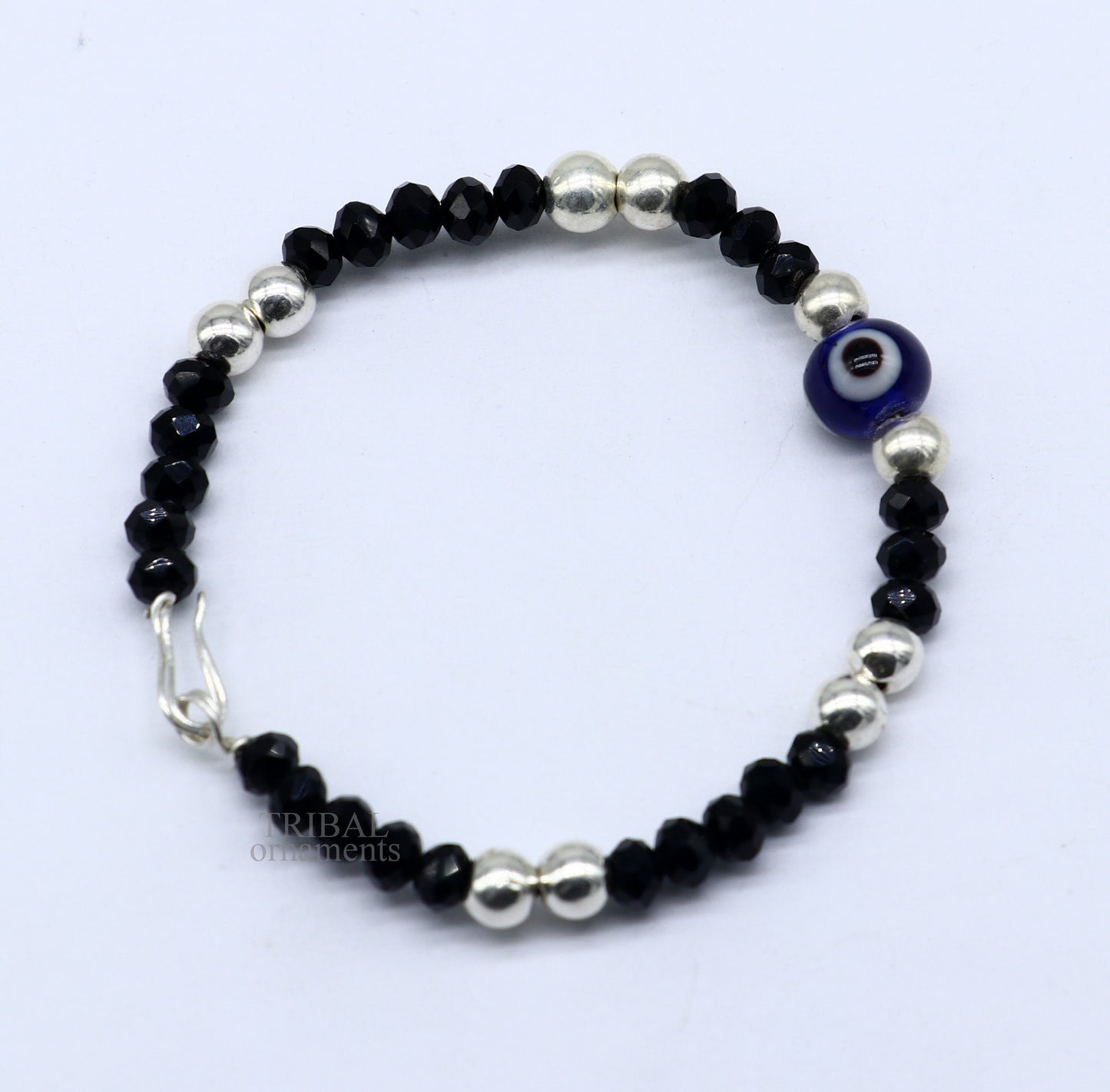 Sterling silver handmade beaded evil eye bracelet by TRIBAL ORNAMENTS, stylish unisex kids jewelry with vibrant beads and protective evil eye charm.