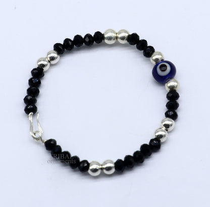 Sterling silver handmade beaded evil eye bracelet by TRIBAL ORNAMENTS, stylish unisex kids jewelry with vibrant beads and protective evil eye charm.