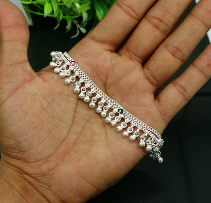 Handmade sterling silver anklet with waved jingling bells, perfect as a baby foot charm or kids jewelry from Tribal Ornaments.
