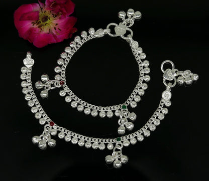 Handmade 5-inch sterling silver baby ankle bracelet with dainty charms, unisex design, elegant and customized jewelry by Tribal Ornaments.