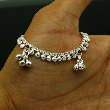 Handmade sterling silver baby ankle bracelet with dainty charm, 5 inches long, unisex design, elegant and customizable.