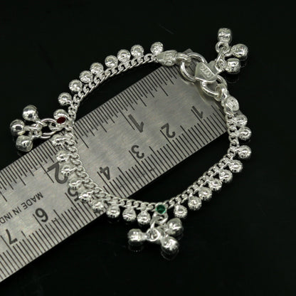 Handmade sterling silver baby ankle bracelet with dainty charm, 5 inches long, unisex design, elegant and customizable jewelry.