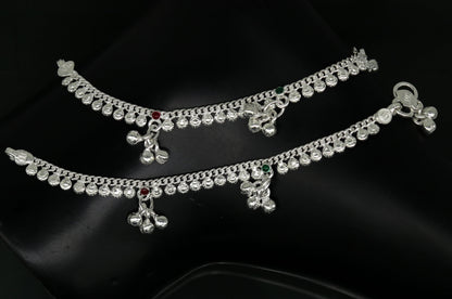Handmade 5-inch sterling silver baby ankle bracelet with dainty charms, suitable for kids and unisex jewelry, by TRIBAL ORNAMENTS.