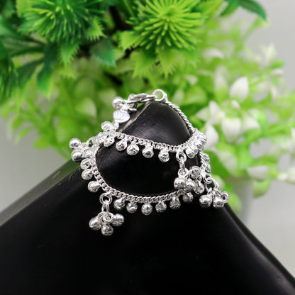 Handmade 5-inch sterling silver baby ankle bracelet with dainty charm, unisex elegant jewelry by Tribal Ornaments.