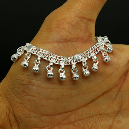 Handmade 5-inch sterling silver baby ankle bracelet with customized charms, unisex design, crafted by TRIBAL ORNAMENTS.
