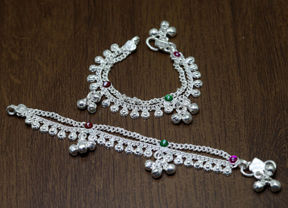 Sterling silver double chain ankle bracelet with jingling bells for newborn babies, featuring a charming charm and noisy sound.