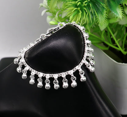 Sterling silver vintage-style baby anklet with waved hanging bells, handmade tribal design, perfect for delicate ankle jewelry.