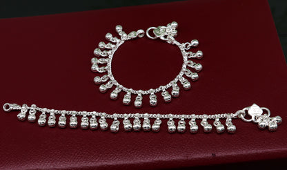Vintage sterling silver baby anklet with waved hanging bells, handmade tribal design, 5-inch length, charm bracelet style.