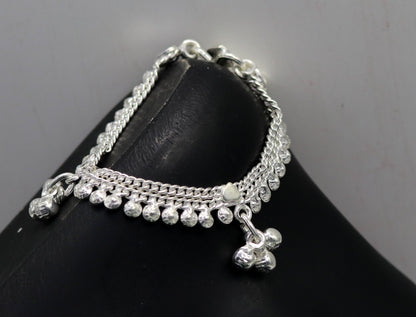 Sterling silver handmade newborn baby ankle bracelet with charms, designed for kids, featuring a delicate foot jewelry style.