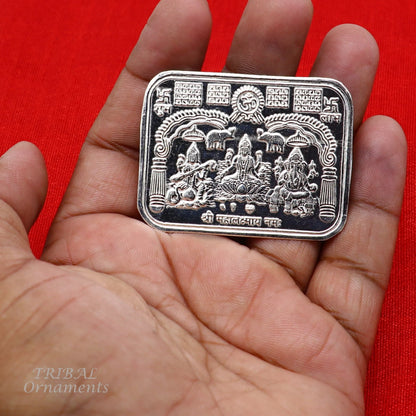 Handmade 925 sterling silver Shree Lakshmi, Ganesha, and Saraswati divine frame for prosperity, crafted by Tribal Ornaments.