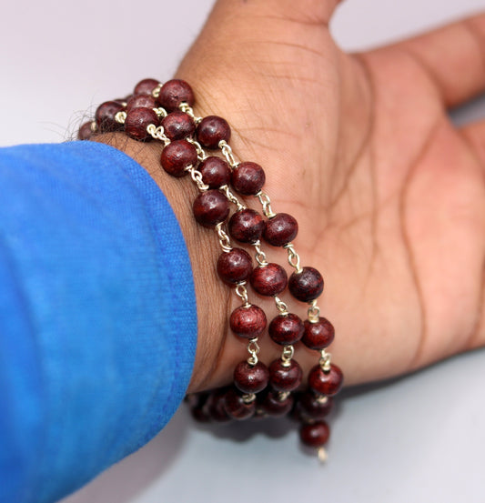 Red sandal chandan beads prayer mala with 925 sterling silver chain, tribal regional jewelry from India, ideal for spiritual rituals.