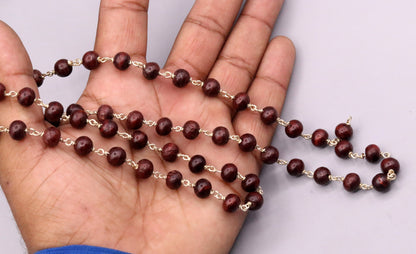 Red sandal chandan jaap mala with 54 beads on a 925 sterling silver chain, tribal jewelry from India for prayer and spiritual rituals.