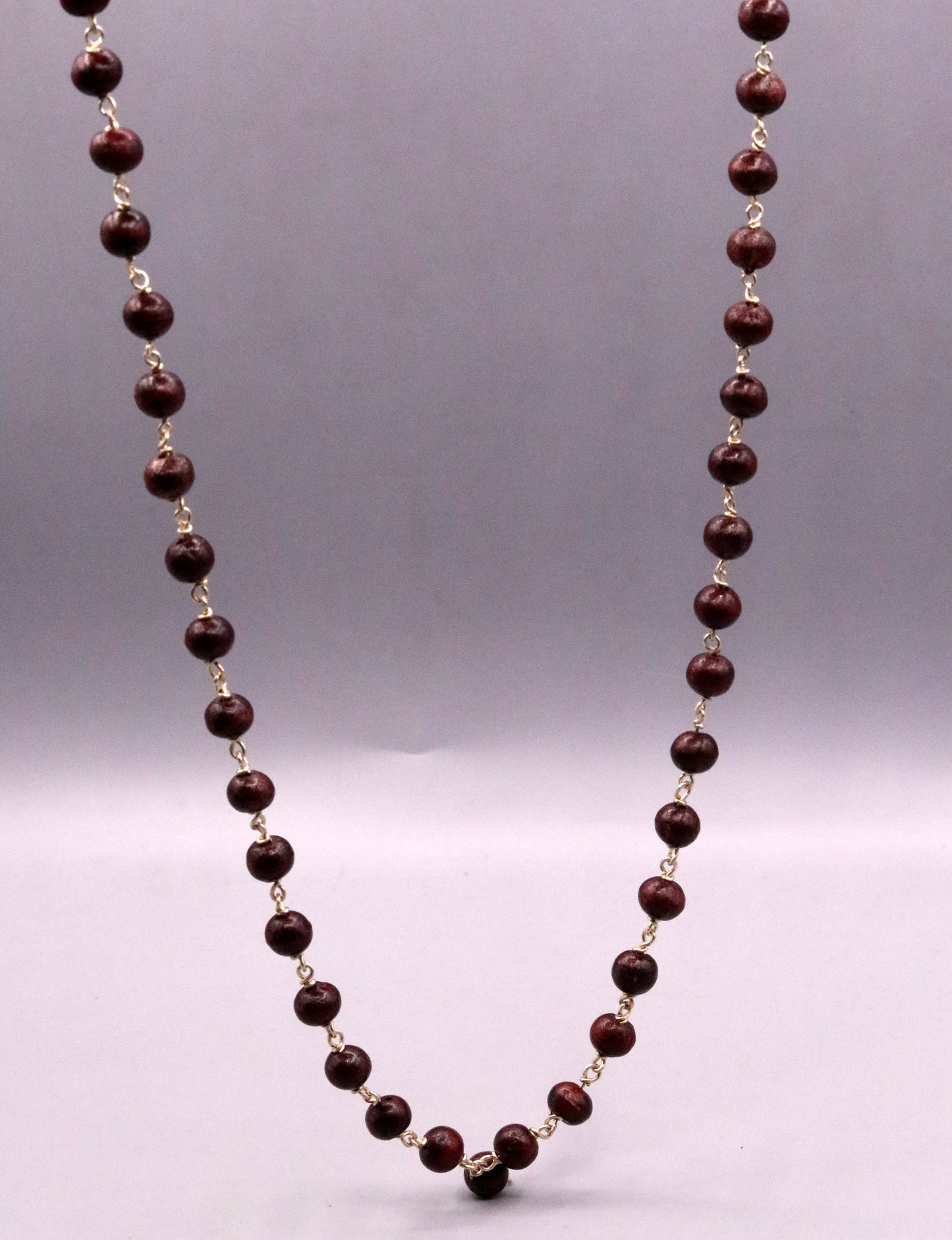 Red sandal chandan jaap mala with 54 beads on a 925 sterling silver chain, traditional tribal jewelry from India.
