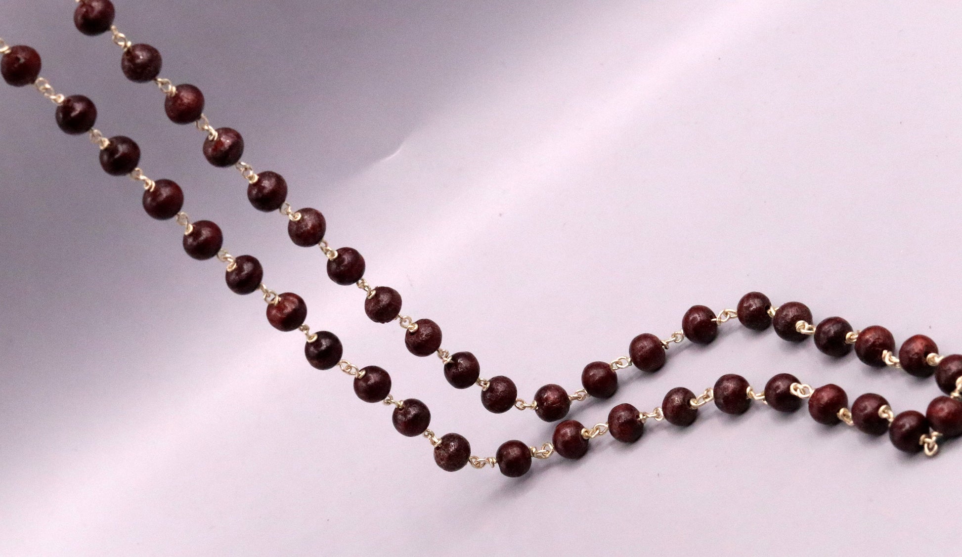 Red sandal chandan jaap mala with 54 beads on a 925 Sterling silver chain, traditional tribal jewelry from India.