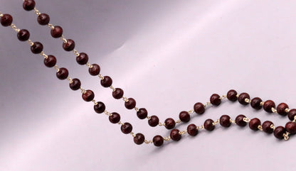 Red sandal chandan jaap mala with 54 beads on a 925 Sterling silver chain, traditional tribal jewelry from India.